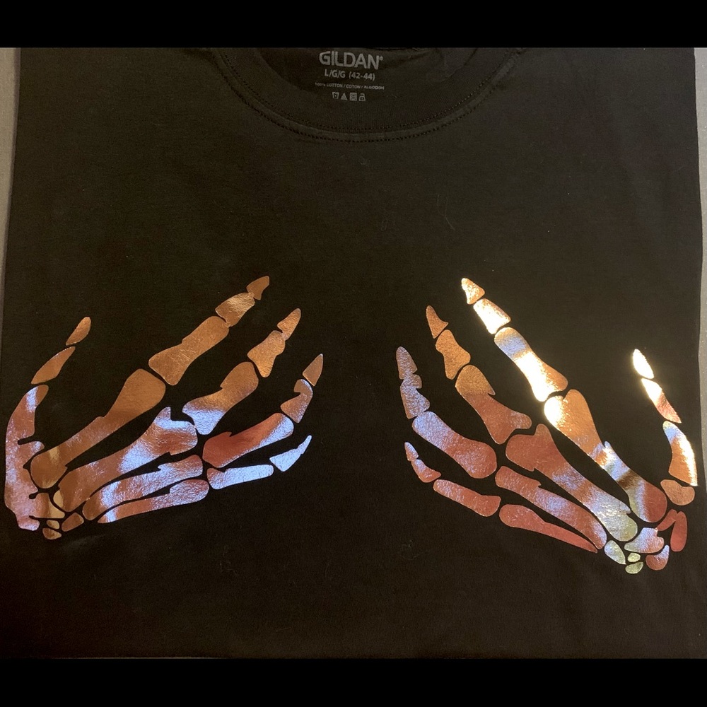 T-shirt with rose gold hand design.